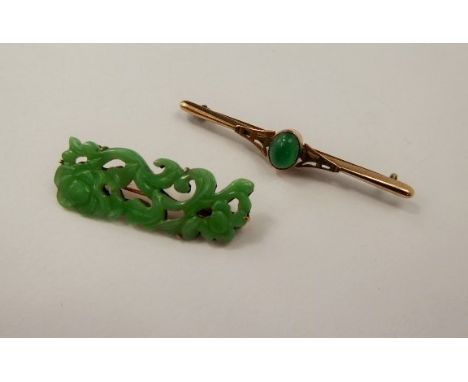 A Vintage Yellow Gold and Green Cabachon Stone Brooch approx 8 x 6 mm, together with another carved jade 9ct yellow gold broo