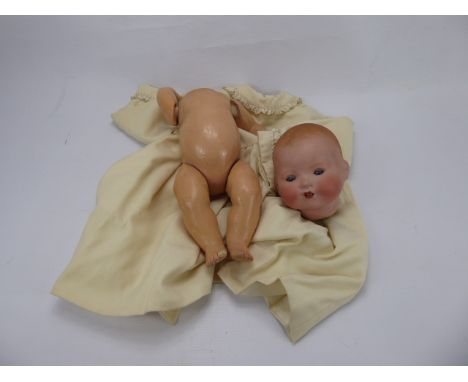 Armand & Marseilles Bisque Headed Doll, sleeping infant with open mouth revealing two teeth, with composite body and limbs, n
