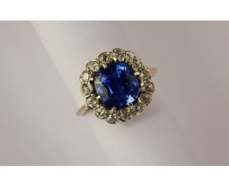 An Exquisite Antique Natural 3.21 ct Vivid Cornflower Blue Non Heat-treated Ceylon Sapphire and Diamond Ring. The clear recta