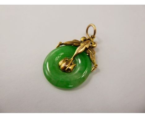 A Chinese 9 ct Yellow Gold and Bright Green Jade Pendant, the pendant having fine engraving with lotus form mount,  approx 23