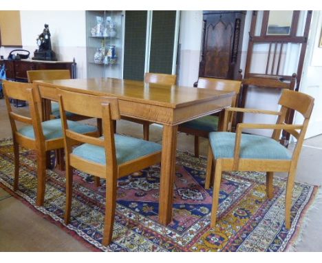 A Gordon Russell Oak 'Weston' Dining Room Suite, comprising: a set of four standard dining chairs and two carvers, a rectangu