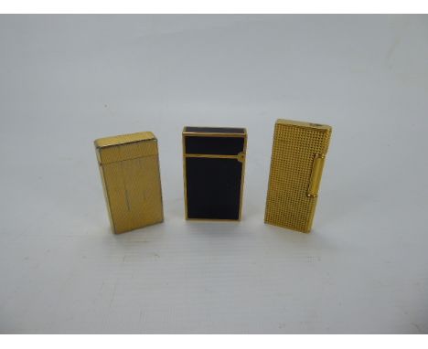 Gentleman's Lot, Du Pont Black Enamel Lighter with two Colibri London Lighters. (3)