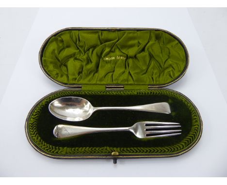 A Silver Christening Spoon and fork set in the original box. London hall mark, dated 1910, mm R.S, approx 51 gms.