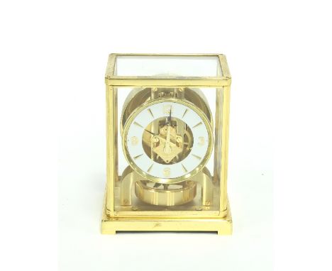 A Jaeger-LeCoultre atmospheric clock in a gilt brass glazed case, 22cm high Condition Report: Recently in working order, not 