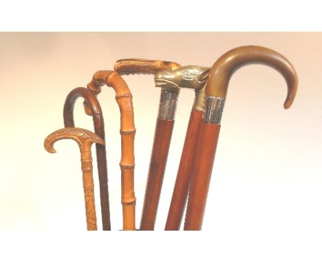 A malacca walking stick with curved horn handle and sundry walking sticks and umbrellas (6)