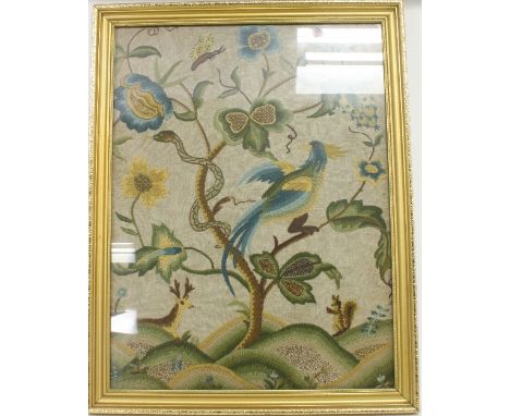 A panel of Jacobean style needlework, depicting a deer, a snake and a bird within a flowering tree, 59cm x 45cm