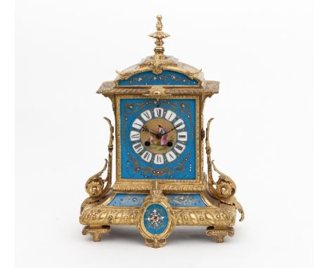 A late 19th Century French ormolu and porcelain mounted eight-day mantel clock, the dial decorated with a central woman, a do
