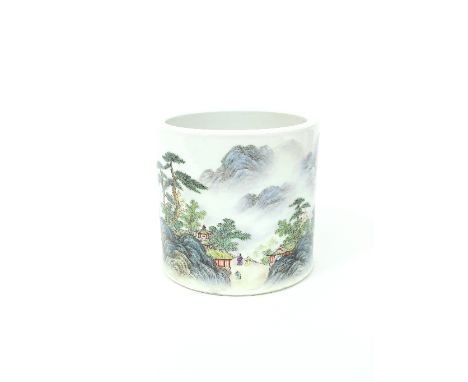 A Chinese porcelain brush pot, 20th Century, decorated an extensive mountain landscape and inscribed, seal mark beneath, 15.5