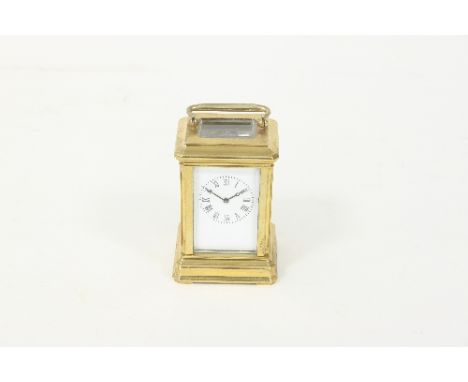 A miniature gilt brass carriage clock with rectangular enamel dial and eight-day movement and a French carriage alarm