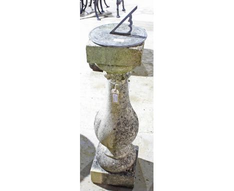 A reconstituted stone sundial with baluster column support, 67cm high