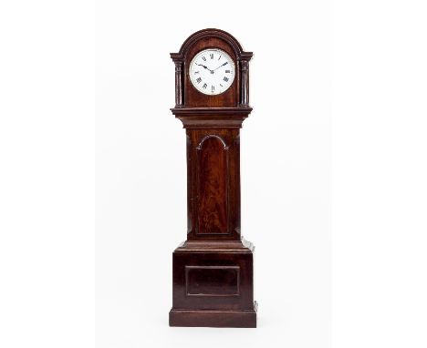 A miniature mahogany longcase clock case, the arch top hood with columns to the sides and canted columns to the trunk, fitted
