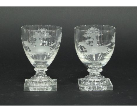 A pair of early 19th Century glass rummers finely etched hunting scenes, on square lemon squeezer bases, 14cm high Condition 