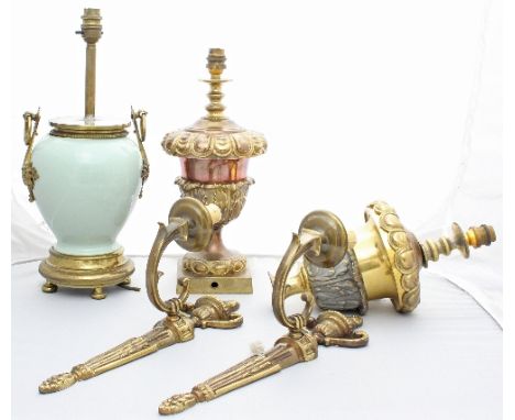 A pair of gilt single branch wall lights, a pair of gilded table lights and a porcelain table light with gilt metal mounts