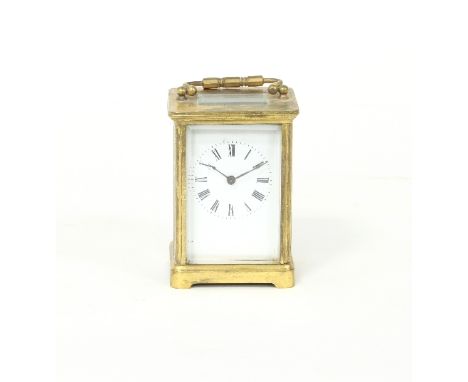 A gilt brass cased carriage clock, the white enamel dial with Roman numerals