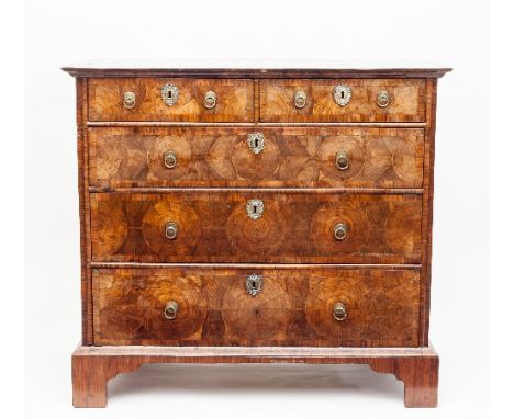A William and Mary kingwood chest, the geometric top with oyster veneer and cross banded borders, fitted with three long and 