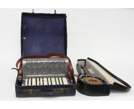 A ukulele in a case and a piano accordion