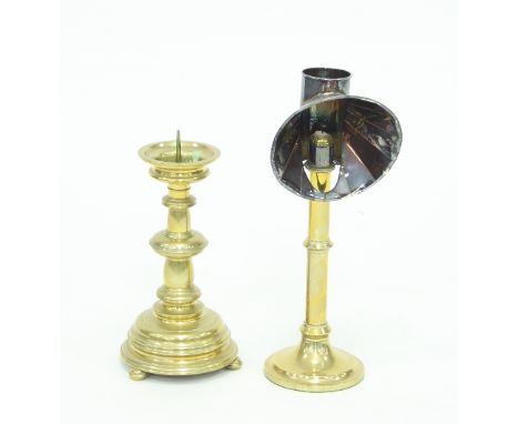 A 19th Century brass candle lamp with shade, 40cm high and a large brass pricket candlestick, 32cm high