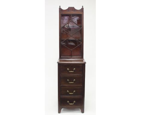 A narrow mahogany bookcase, the upper section enclosed by a glazed door, the lower section fitted four drawers on bracket fee