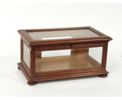 An Edwardian glass panelled presentation casket with gothic tracery panel, 36cm wide