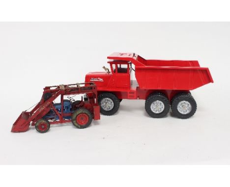 A Budd L red painted dumper truck, boxed and a bespoke tractor lift model
