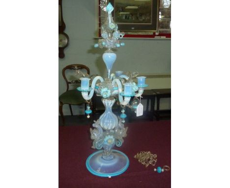 A latticino glass four-light table light in opaque blue with blue glass borders on a dolphin support Condition Report: Missin