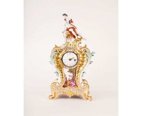 A Meissen porcelain mantel clock case, circa 1745, painted cartouches of figures including musicians within gardens and surmo