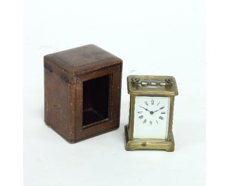 A gilt brass carriage clock in a leather case