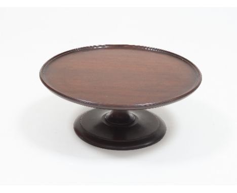 A mahogany lazy susan with dish top on central stem and circular foot, 37cm diameter Condition Report: Old repair to top of s