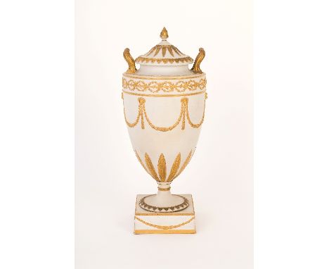 An early 19th Century Wedgwood two-handled vase of classical form with flower finial to the sunburst gilded cover, the vase a