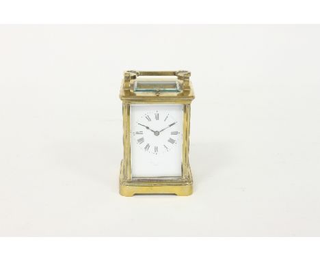 A late 19th Century gilt brass carriage clock, the rectangular enamel dial with Roman numerals and signed Boddington, Paris, 