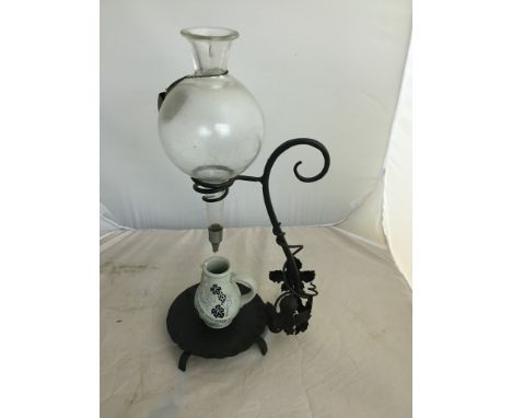 A 19th/20th century cut glass and wrought iron wine dispenser