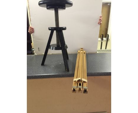 A Windsor & Newton easel together with a revolving stool