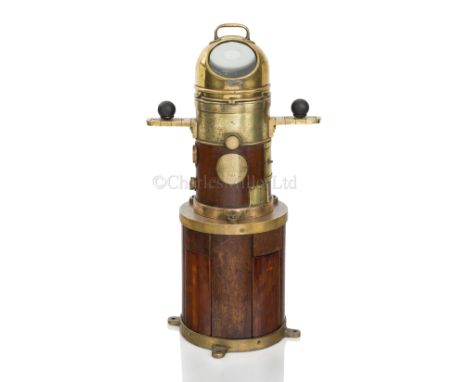 A FAITHFUL FREDDIE COMPASS AND STAND, CIRCA 1910 constructed in wood and brass, with 3½in. compass card in liquid-filled gimb