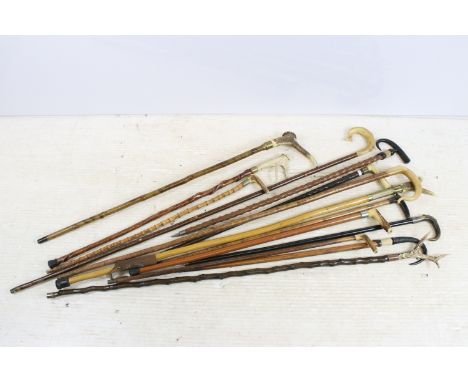 Assorted collection of walking stick canes with antler and horn stylised handles