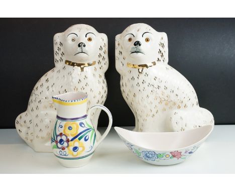 1960's Poole Pottery floral jug together with freeform bowl and a pair of large spaniel flatback dogs with glass eyes, H 35cm