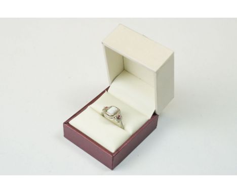 A ladies Art Deco style dress ring with opal to centre, marked S925 to the inner shank.