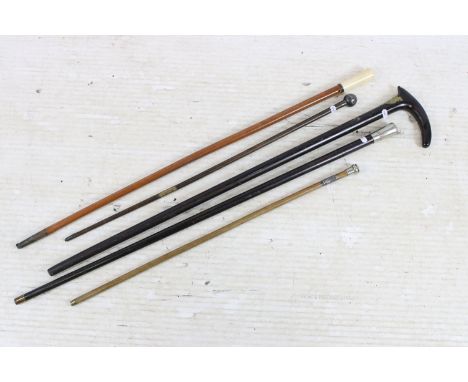 Collection of five walking sticks / canes, comprising: a Devon Constabulary swagger stick, hallmarked collar for London 1903,
