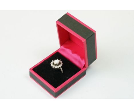 A ladies dress ring with opal to centre, marked S925 to the inner shank.