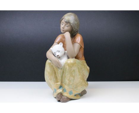 Lladro A comforting friend figurine, No 2380, modelled as a young seated girl with animal, H 32cm