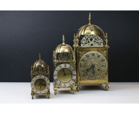 Group of three graduating 19th Century / early 20th Century brass lantern clocks, largest having a movement signed FHS. Talle
