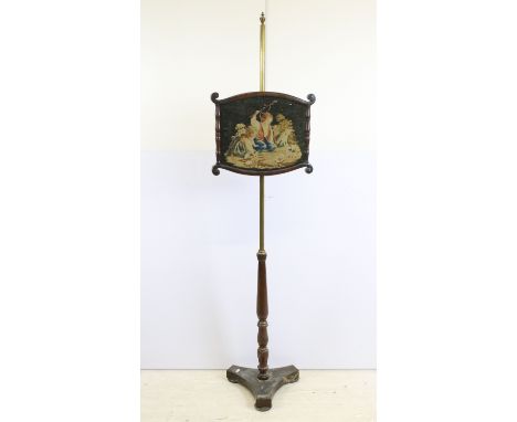 19th century brass and mahogany floor standing fire screen decorated with a tapestry of children and a cat playing with kitte
