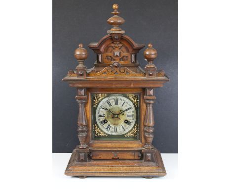 Antique Junghans German mantel clock with carved pediment and column detail, H 47cm