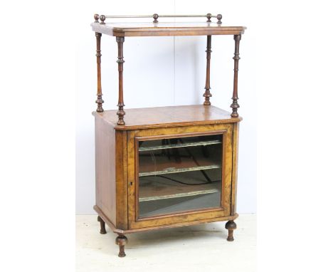 Victorian walnut music cabinet having glazed front cupboard to base with leather fronted shelves beneath upper shelf raised o