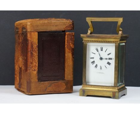 An antique French brass cased carriage clock with bevelled glass panels, retailer marked for Gaydon &amp; Sons of Kingston on