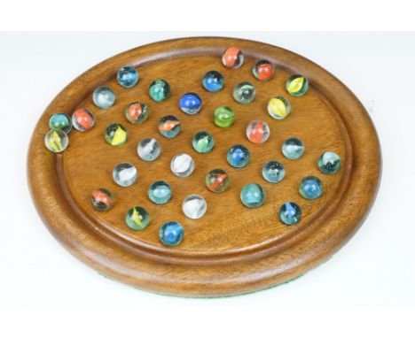 Vintage wooden solitaire board with 35 glass marbles, board 25cm diameter