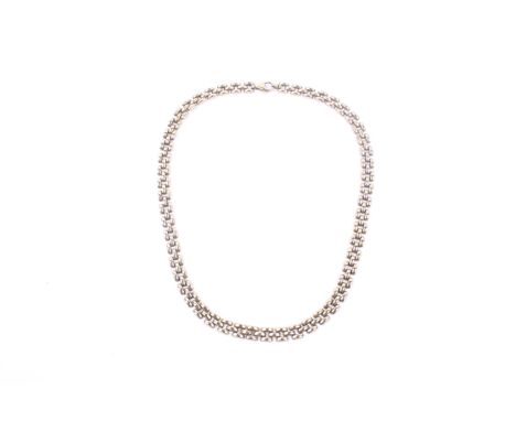 A vintage Italian 9ct gold three-row block necklace. On a trigger clasp, Sheffield convention hallmarks, 44cm long overall (1