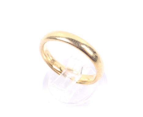 A vintage 22ct gold court-section wedding band. Hallmarks for Birmingham 1926, 3.4mm wide, size M, 5,4g