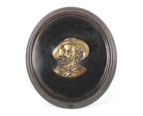 A Continental 19th century brass relief of Peter Paul Rubens (1577-1640). Mounted on an oval slate with moulded brass frame, 