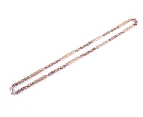 A vintage 9ct rose gold fancy link necklace in Victorian style. The necklace in the form of eight fancy-engraved rectangular-
