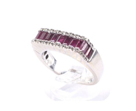 A vintage Italian 18ct white gold, ruby and diamond dress ring. With a central band of 12 calibre rubies between small round 